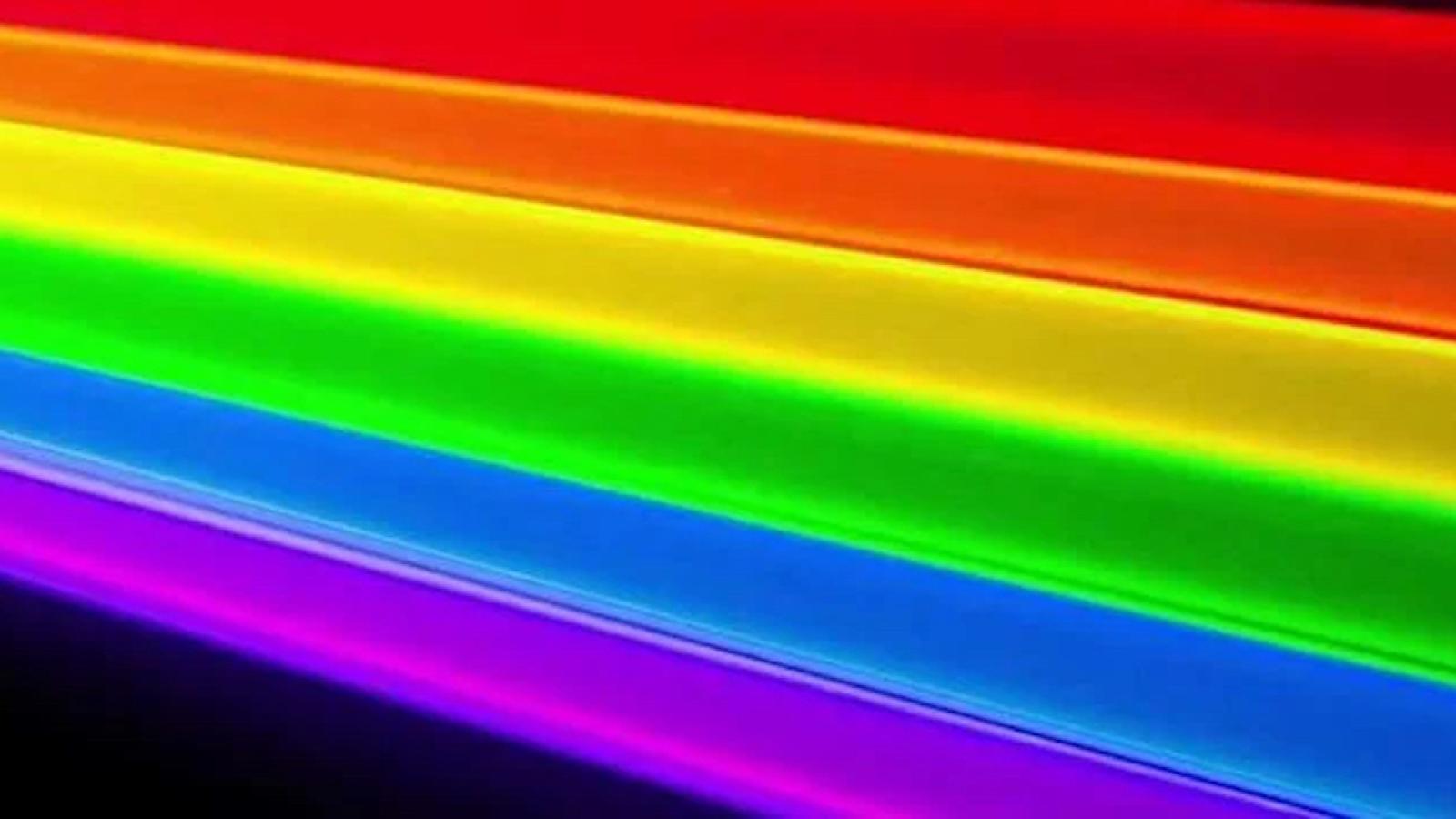 Laser rainbow against a black background