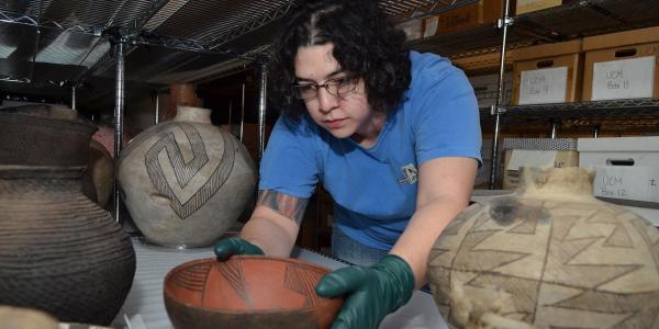 Installation of Native American pottery exhibit