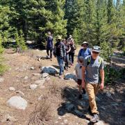 Faculty, students and technicians from CU ɫ and the University of Wyoming walk the site of the newly installed EcoTram near INSTAAR’s Mountain Research Station.