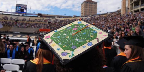 A decorated graduation cap during commencement ceremony